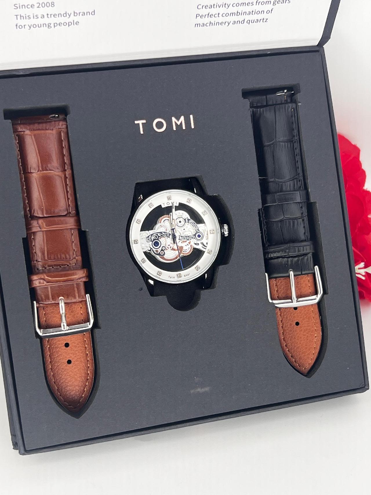 Tomi. brown and black